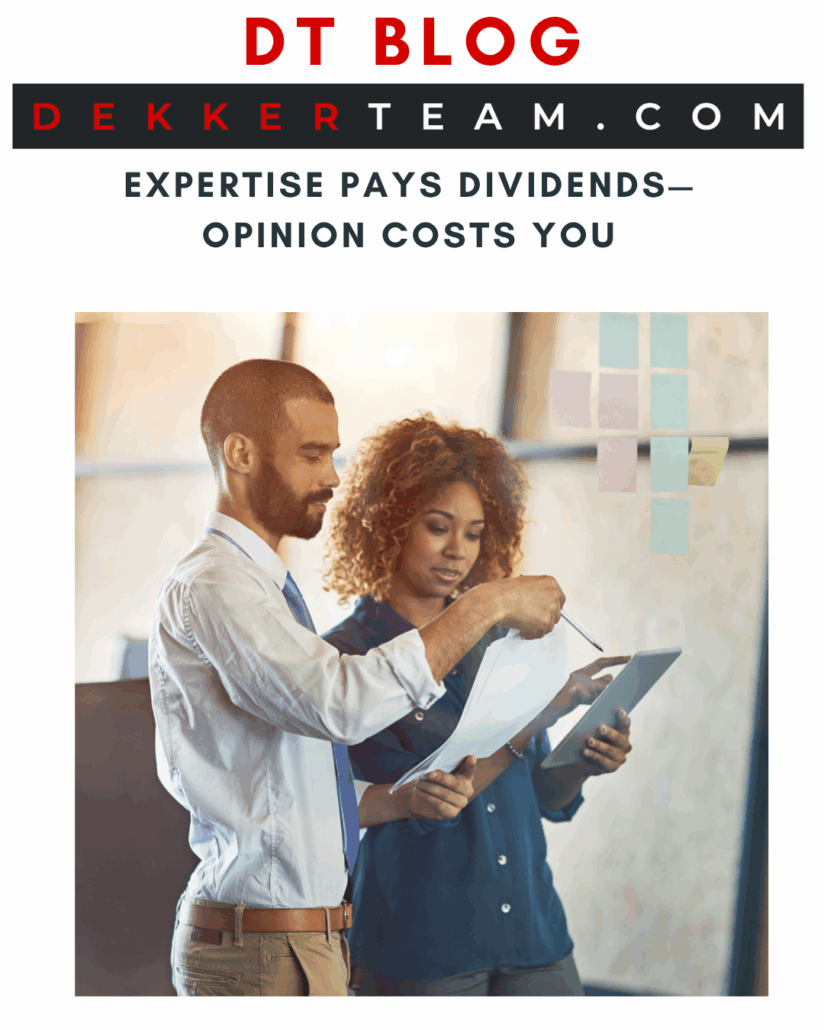 Two people looking at papers in an office DT blog Expertise Pays Dividends— Opinion Costs You
