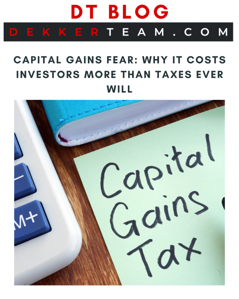 DT BLOG: Capital Gains Fear: Why It Costs Investors More Than Taxes Ever Will IMAGE: A calculator and a sticky note with "Capital Gains Tax" written on it, next to a blue notebook.