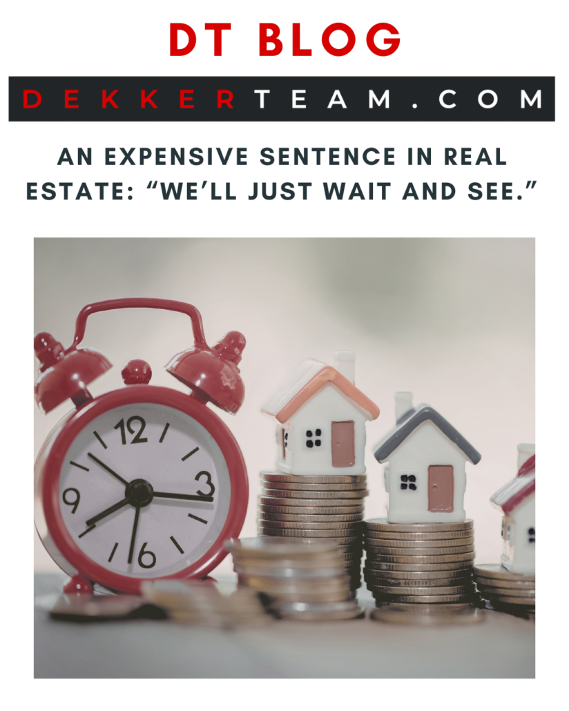 title: An Expensive Sentence in Real Estate: “We’ll Just Wait and See.” IMAGE: A red alarm clock sits next to stacks of coins topped with miniature houses, symbolizing time and real estate investment.